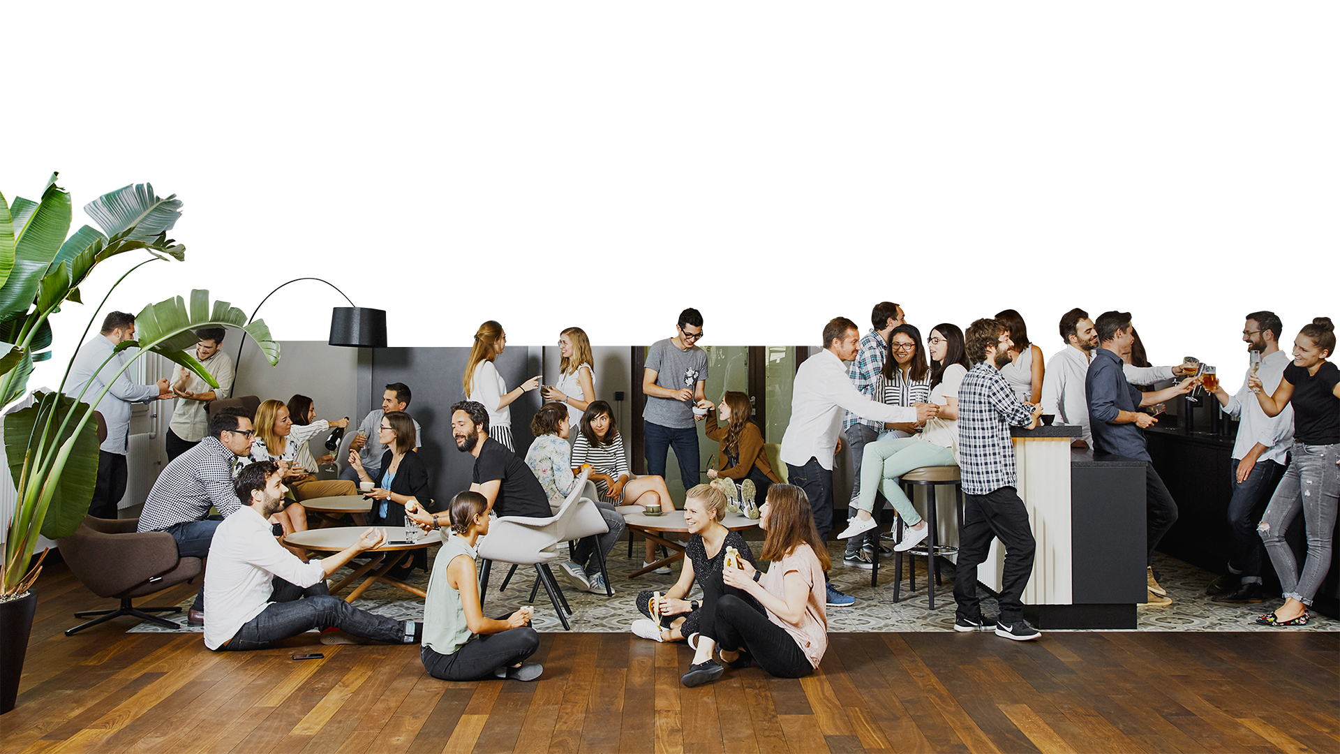 A group of people sitting around each other in a room.